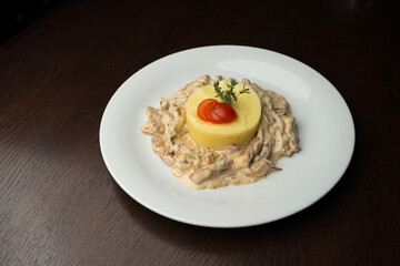 mashed potato with meat and sauce on white plate
