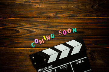 Coming soon text on the wooden background