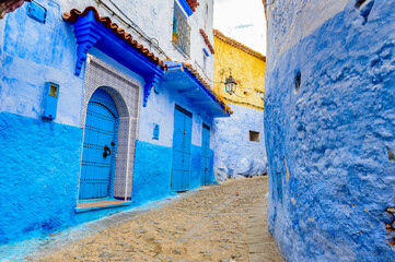 Fototapeta na wymiar It's Blue walls street of Chefchaouen, Morocco.