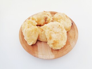 Fried fermented cassava, Indonesian famous street food or street snack. Indonesian called tape goreng, rondo royal or fried peuyeum. Sweet, creamy, crunchy outside, little oily and delicious.