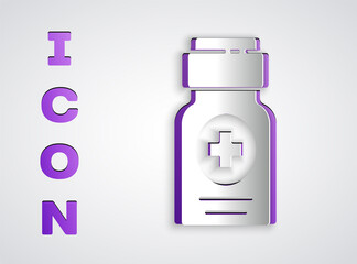 Paper cut Medicine bottle icon isolated on grey background. Bottle pill sign. Pharmacy design. Paper art style. Vector Illustration.
