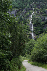 Beautiful Waterfal in a green landscape located in India (Manali), a popular tourist destination for Trekking and Adventure