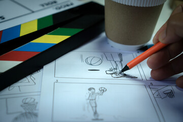 Designer creative drawing in storyboard for film movie, Video Pre-production process in display...