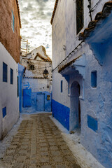 Fototapeta na wymiar It's Blue painted walls of the houses in Chefchaouen, small town in northwest Morocco famous by its blue buildings