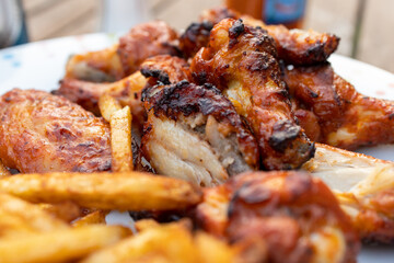 Spicy chicken wings and seasoned fries