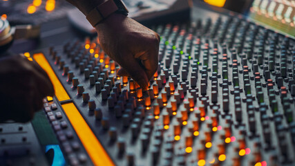 Close up Shot of Surface Control Desk EQ Mixer. Artist Works in the Music Record Studio. Buttons,...