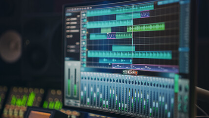 Modern Music Recording Studio Equipment: Computer Screen Showing User Interface of DAW Digital...