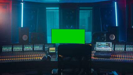 Modern Music Record Studio Control Desk with Green Screen Chroma Key Computer, Equalizer, Mixer and...