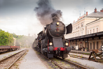 Fototapeta na wymiar Old steam train - locomotive leaves the Nova Gorica railway station