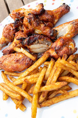 Spicy chicken wings and seasoned fries