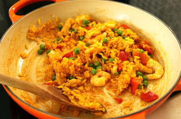 Paella in a pan on the hob