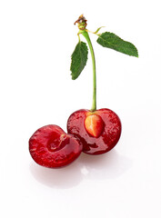 Fototapeta na wymiar cherries cut in half isolated on a white background 