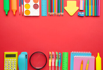 Back to school concept on red background. Top view - Powered by Adobe