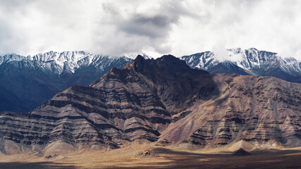 Mountain range landscape with a dark clouds. View of the sideroad at Leh Ladakh