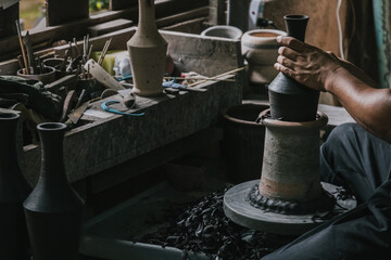Artisan potter making art pot handicraft