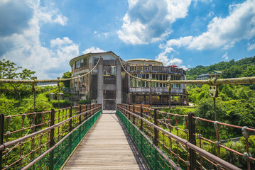 ruin at the end of a suspension bridge in new taipei, taiwan