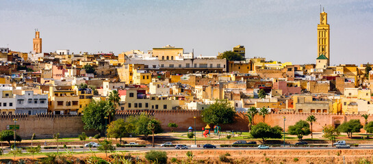 It's Panoramic view of Meknes, a city in Morocco which was founded in the 11th century by the Almoravids as a military settlement, - obrazy, fototapety, plakaty