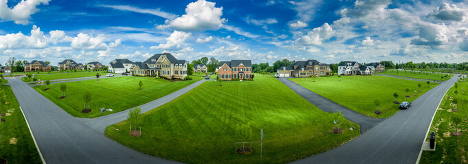 Large luxury real estate property sitting on more than an acre land with manicured lawn, long drive...