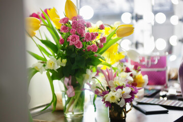 Brush and shadow for makeup on the table in the dressing room. Beauty and fashion.