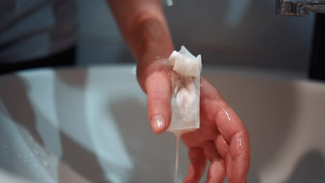 girl pours peroxide on a wounded arm