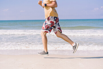 man on the beach near the sea does a jogging training
