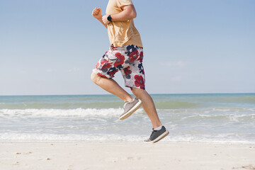 man on the beach near the sea does a jogging training
