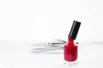 bottle of red nail Polish on a white background isolated