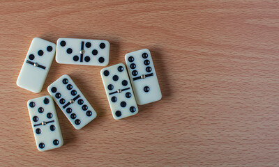 a bunch of domino blocks with numbers on a table, Selective focus, Selective focus on subject, background blur