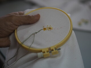Stitches in hand woman Embroidery Flowers Handmade Art with Simple Stitches