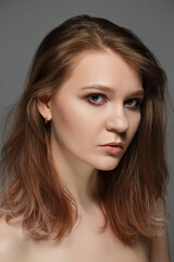 Fototapeta premium Beauty woman portrait on gray background