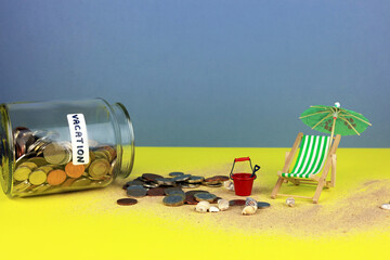 A glass jar labelled vacation. Holiday money concept.