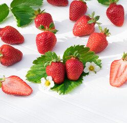 Ripe strawberries forest fruits on white table. Fresh strawberry top view.