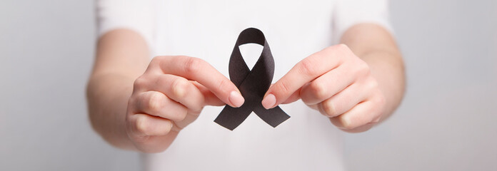 Black Awareness Realistic Ribbon in hands, support, hope