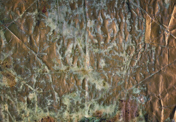 Grunge paper background - crumpled dirty golden surface