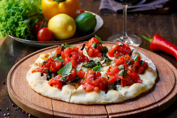 Italian pizza with tomato and basil