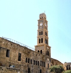 Fototapeta na wymiar Ancient clock tower in a small fishing town