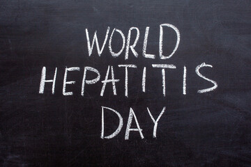 Obraz premium World Hepatitis day text on a chalkboard