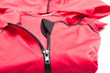 Folded red zipper windbreaker jacket, UV sun proof outdoor jacket hoodie. Track jacket sport hoodie...