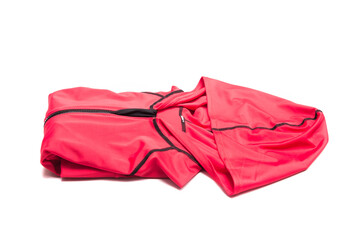 Folded red zipper windbreaker jacket, UV sun proof outdoor jacket hoodie. Track jacket sport hoodie full zip isolated on white background. Folded clothes.
