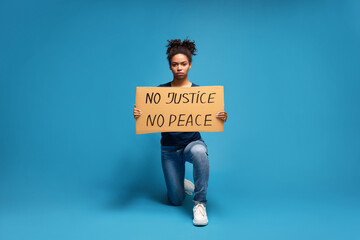 Black woman standing with slogan of USA protest action
