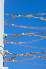 Lines of barbed razor wire