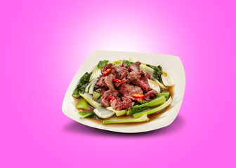 Sauteed Meat and mustard greens, served on a white plate. Stir-fried beef mustard greens.