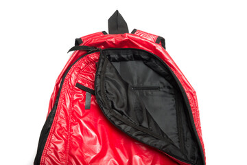 Red shiny nylon backpack isolated on white background. Sport backpack 