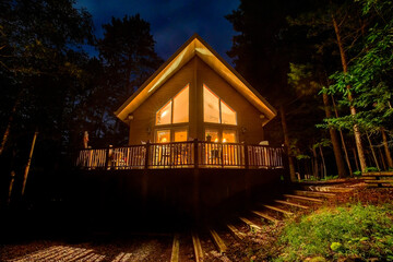 Vacation Home in Woods at Night - Powered by Adobe
