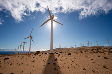 A row of wind turbines in the desert