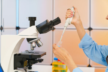 Young woman in a science lab. Health care researchers working in life science laboratory.