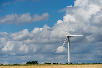 Photograph of wind turbine on a cloudy sky