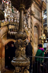 Fototapeta na wymiar Jerusalem, Israel, January 29, 2020: Decorative candlestick in the area of the tomb of Christ in the Basilica of the Holy Sepulcher in Jerusalem,