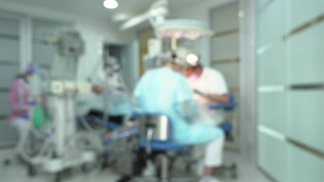 blurred background for dental surgery, where specialist doctors actively work during surgery