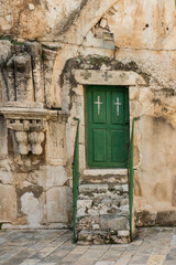 Fototapeta na wymiar Old buildings in a Coptic part of the complex of the Basilica of the Holy Sepulchre in Jerusalem